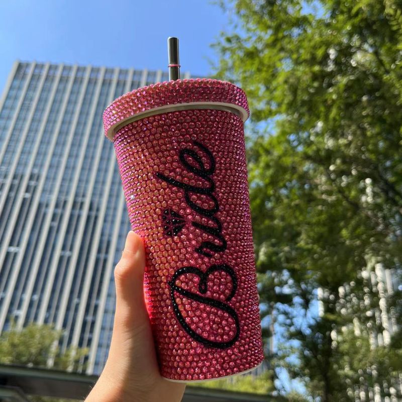 Pink rhinestone double wall stainless steel tumbler with loose straw and round lid hole
