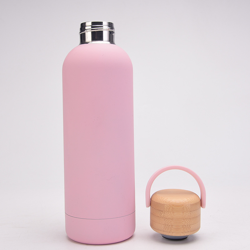 Narrow mouth vacuum insulated stainless steel bottle with wooden screw lid and handle
