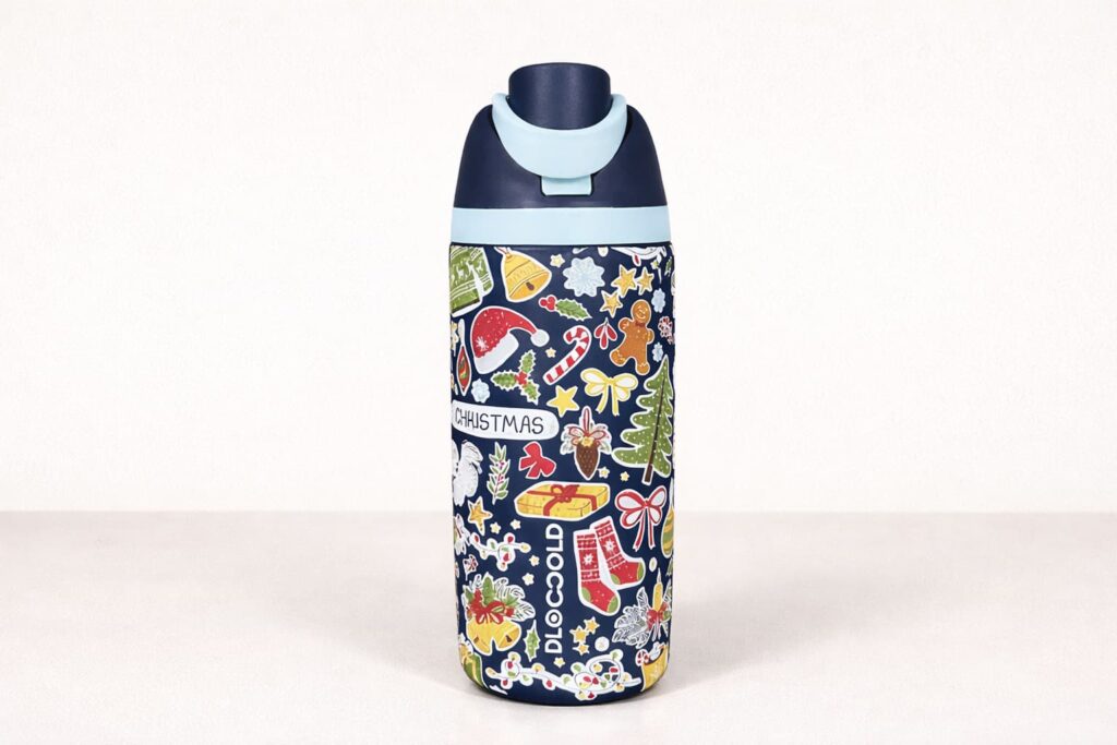 Christmas-themed 3D UV printed stainless steel water bottle with raised full-wrap holiday artwork on a light background