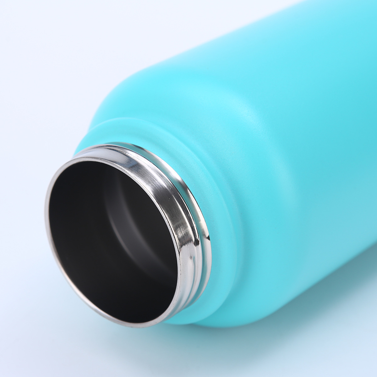 Close-up of bottle mouth and threaded opening