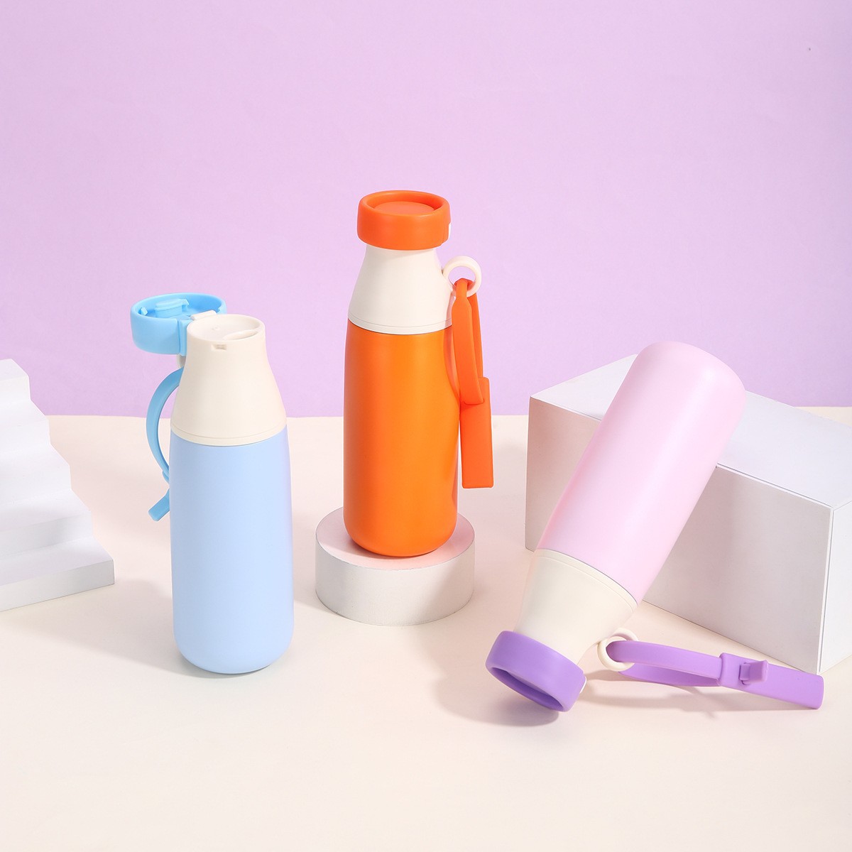 Dopamine color kids insulated bottles with carry straps on studio display