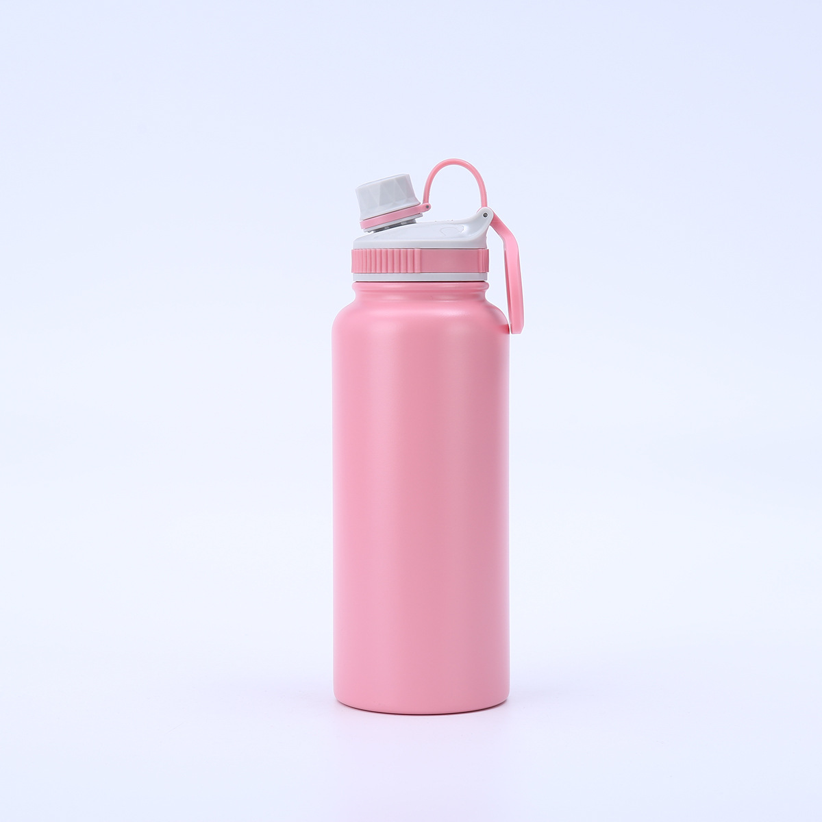 Pink 32oz insulated bottle with spout lid and carry handle