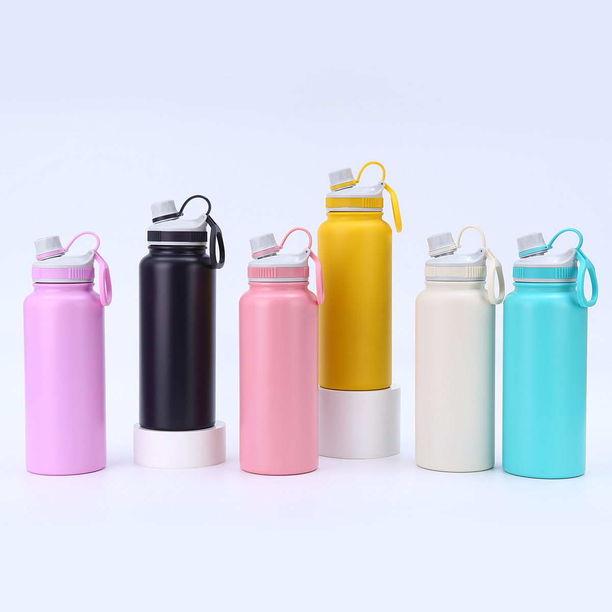 Six color options for 32oz insulated sports bottle with carry handle
