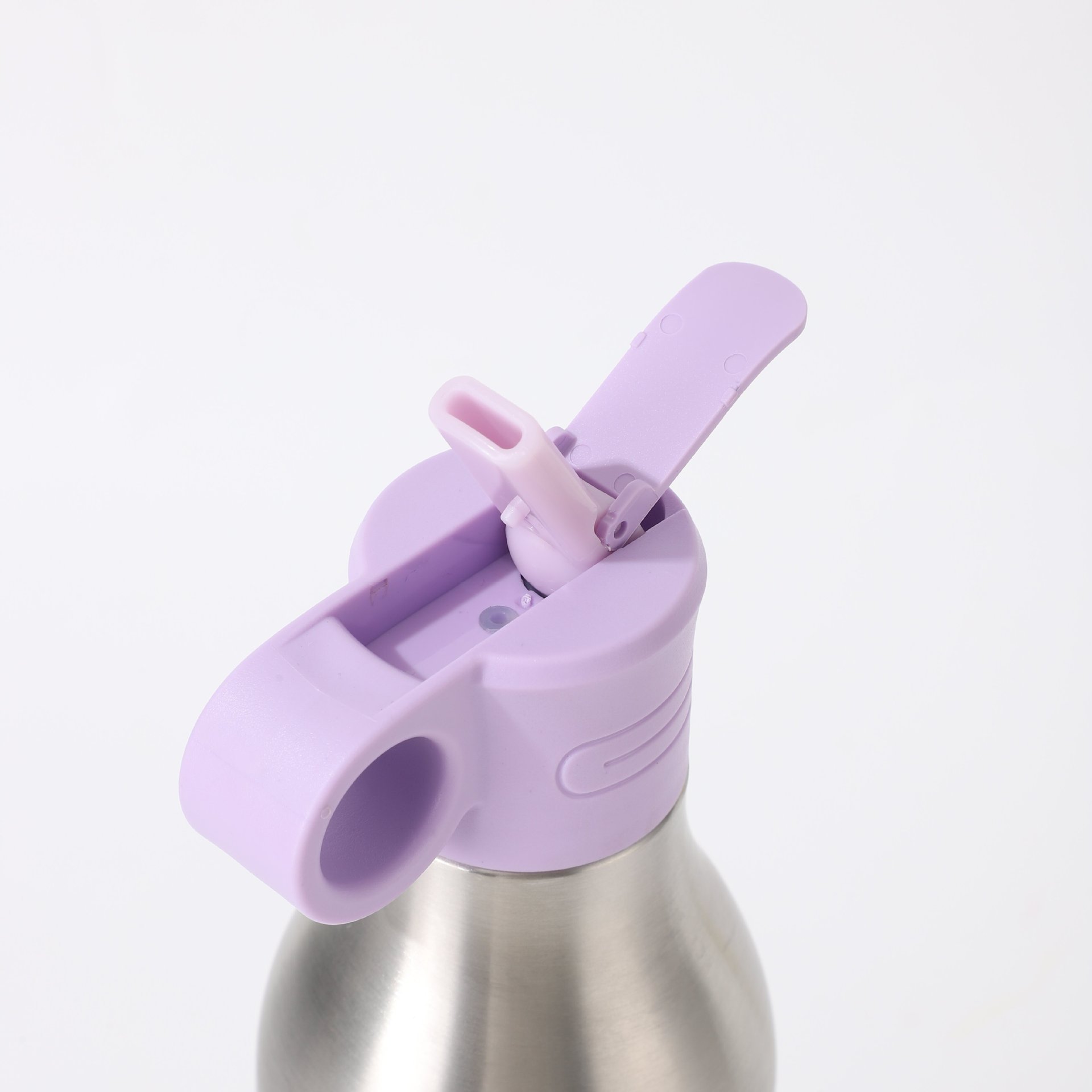 Straw lid flip-top detail on 2-in-1 insulated bottle (lavender cap)