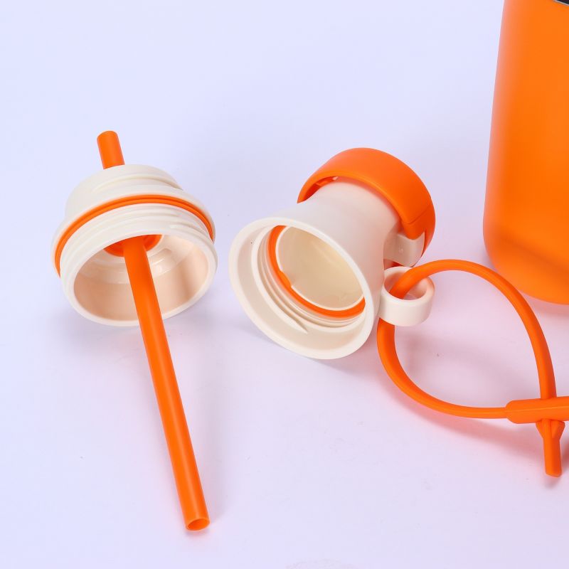 Straw lid parts and silicone seals close-up with carry strap