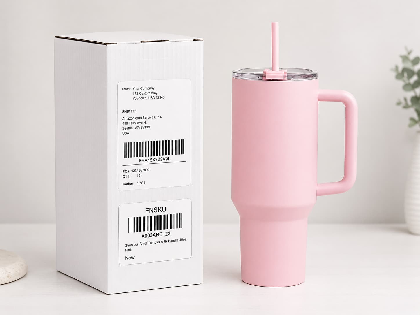 Pink handled tumbler with packaging box and FNSKU barcode labels for e-commerce fulfillment