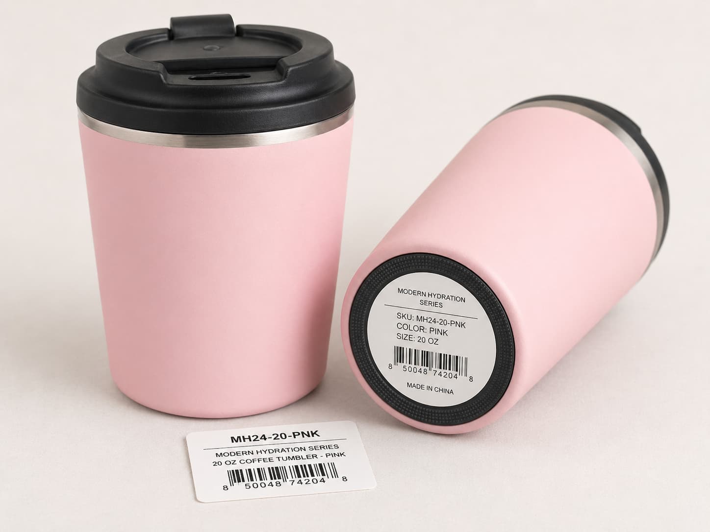 Pink insulated coffee mug with bottom SKU label and barcode label for product identification