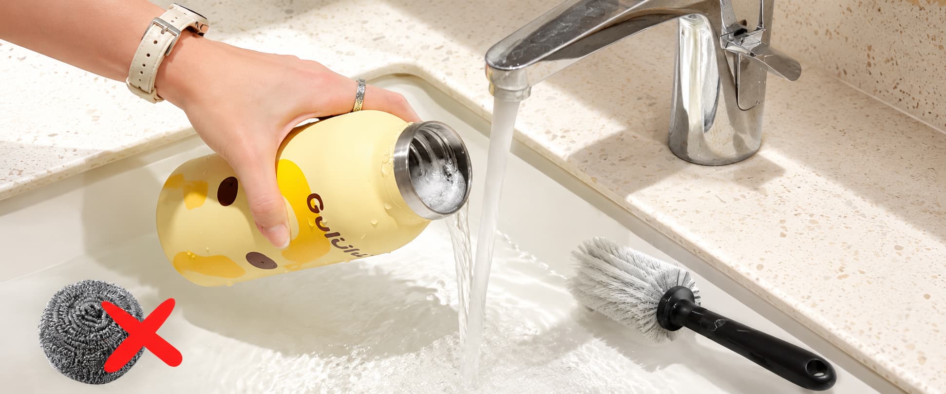 Cleaning a stainless steel insulated bottle with a soft brush and avoiding steel wool