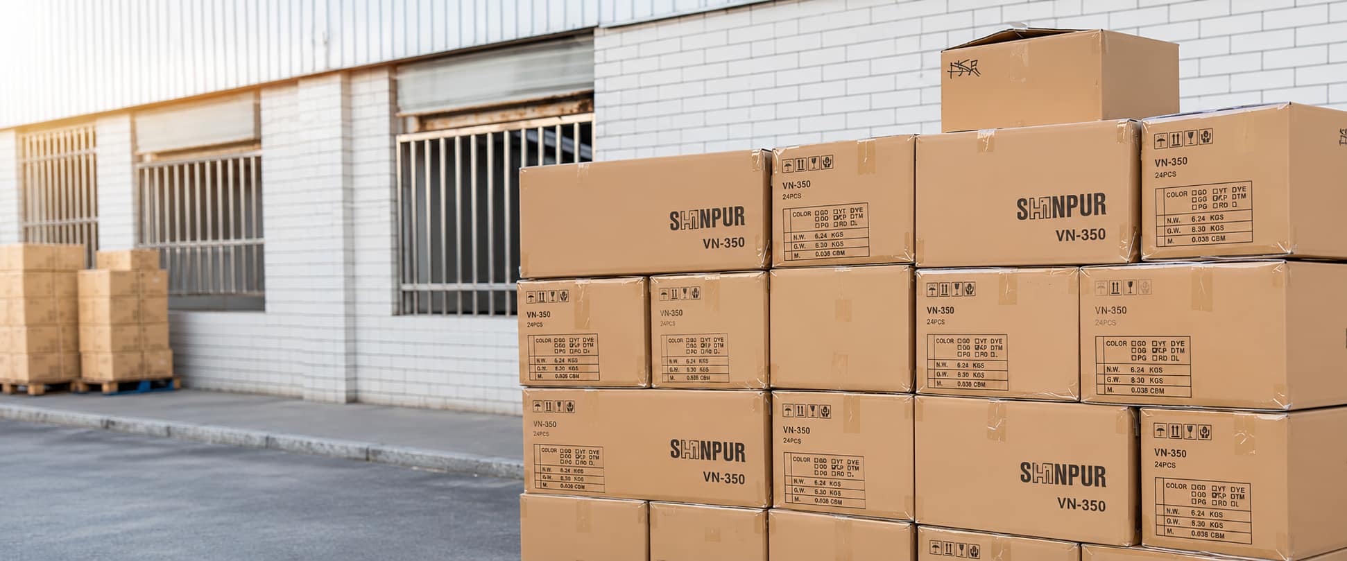 Stacked shipping cartons prepared for custom stainless steel bottle packaging and delivery